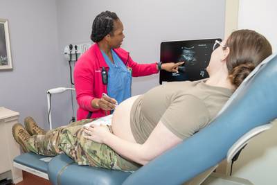 A Certified Nurse Midwife at Martin Army Community Hospital at Fort Benning, Georgia, conducts an abdominal ultrasound during a routine obstetrics appointment in March 2023.